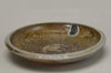 A salt-fired plate in browns and grays.